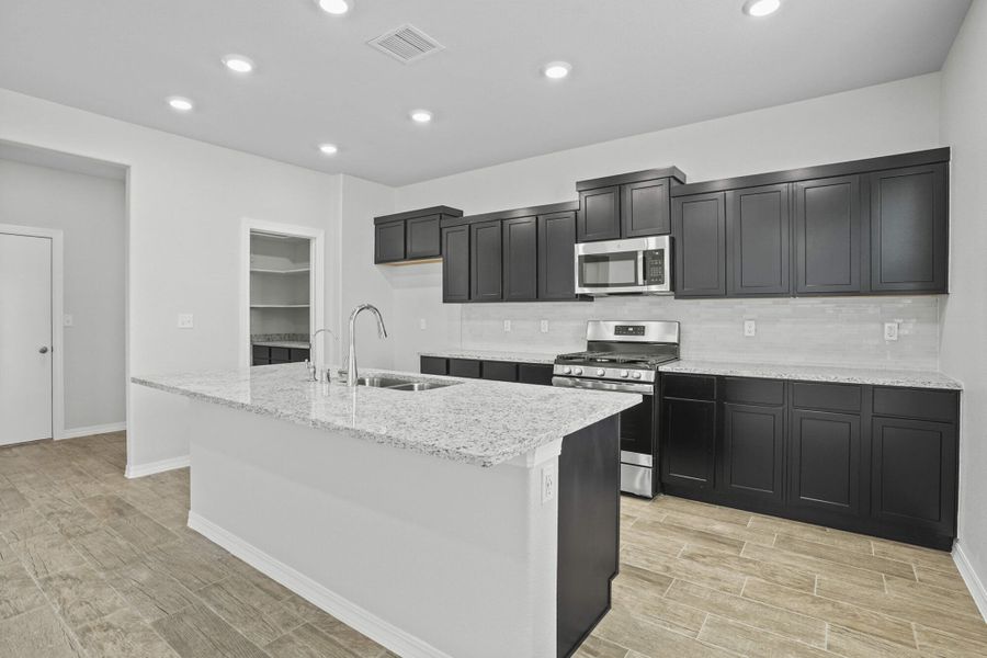 Representative furnished interior of a home built from the Blue Agave by View Homes in Paseos Del Este, Horizon City (Image 11).