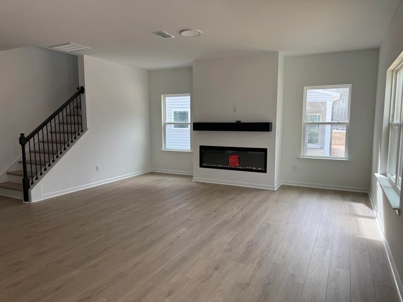 Family Room featuring the AW Collection® Serene - Open space with natural finishes and light. Family Room featuring the AW Collection® Serene - Open space with natural finishes and light.