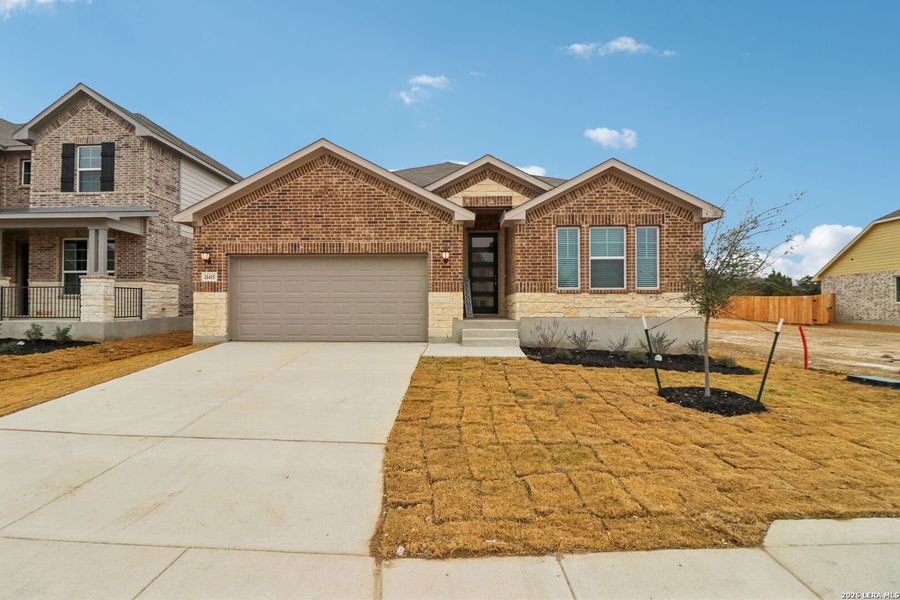 Front exterior of a new home in Sagebrooke - Classic Series, San Antonio, TX, highlighting curb appeal (Image 24).