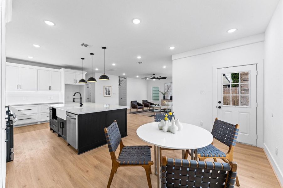 A charming breakfast room rests to the side of the kitchen and offers a nice view of the open floor plan.