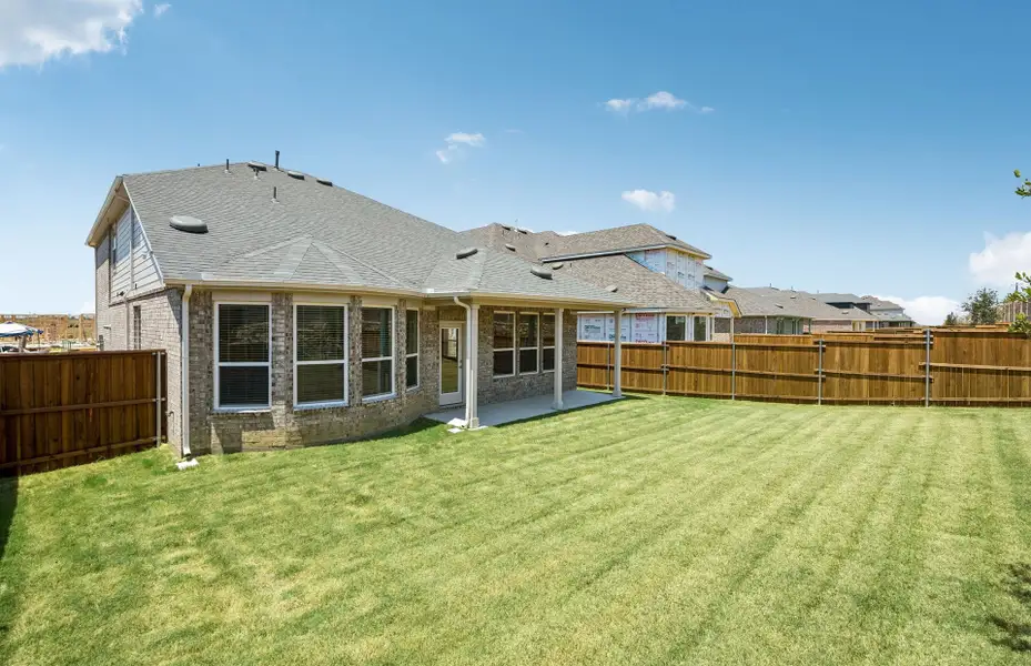 Exterior details and patio area of a home in Pinnacle at Legacy Hills, Celina (Image 3).