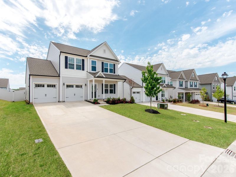 Front exterior of a new home in Sutter's Mill II, Troutman, NC, highlighting curb appeal (Image 22).