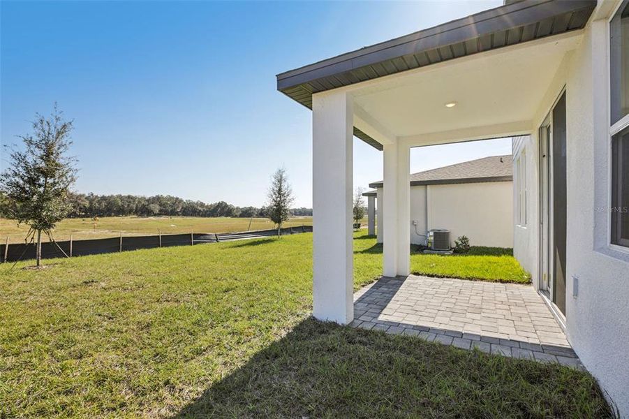 Exterior details and patio area of a home in The Reserve at Hammock Oaks - Classic Series, Lady Lake (Image 23).