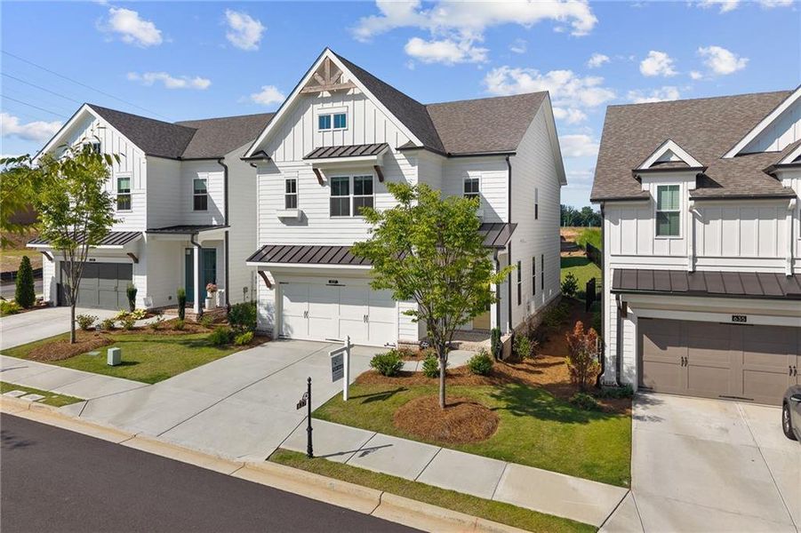 Front exterior of a new home in Palisades Single Family, Cumming, GA, highlighting curb appeal (Image 2). Front exterior of a new home in Palisades Single Family, Cumming, GA, highlighting curb appeal (Image 2).