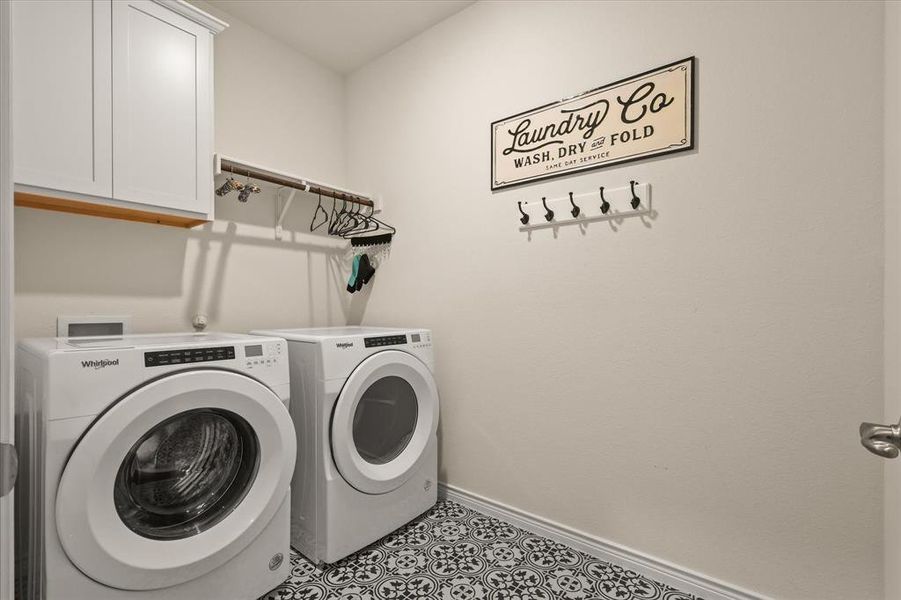 Laundry area featuring washing machine and dryer and cabinet space Laundry area featuring washing machine and dryer and cabinet space