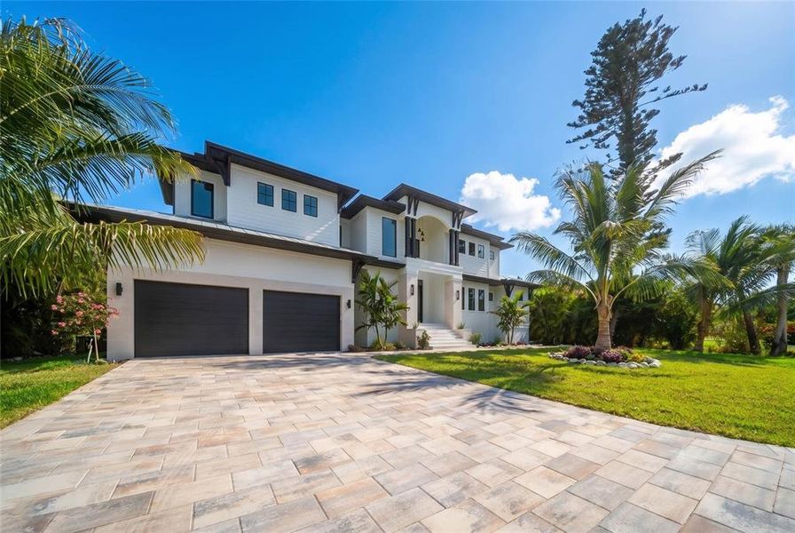 Front exterior of a new home in , Longboat Key, FL, highlighting curb appeal (Image 30). Front exterior of a new home in , Longboat Key, FL, highlighting curb appeal (Image 30).