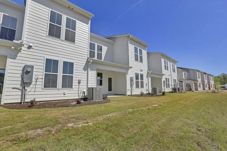 Exterior details and patio area of a home in Grand Park, Leland (Image 3).