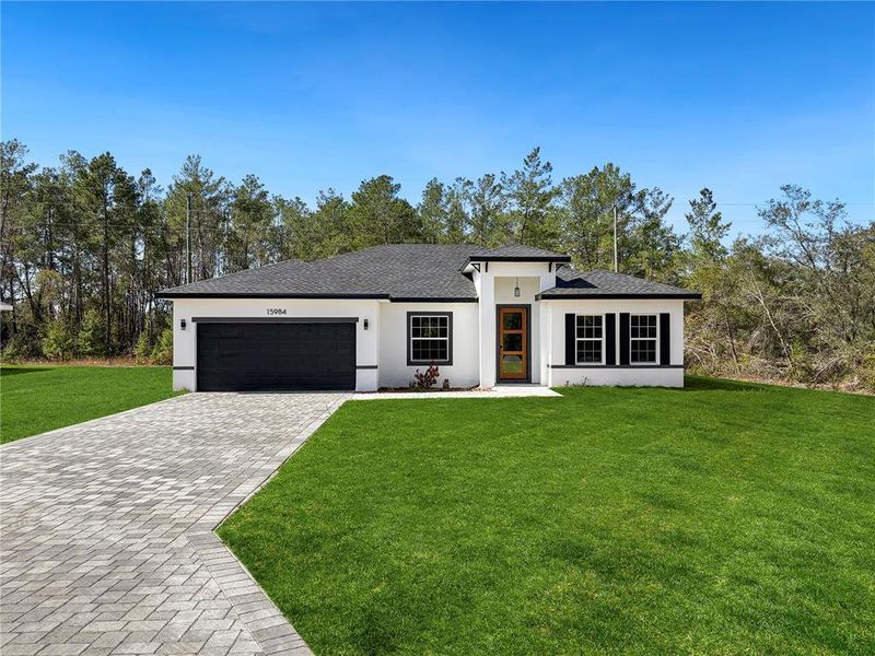Front exterior of a new home in , Ocala, FL, highlighting curb appeal (Image 23).