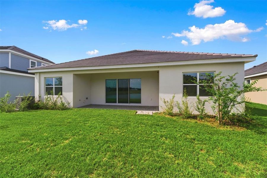 Exterior details and patio area of a home in Tamarack at Two Rivers, Zephyrhills (Image 4).