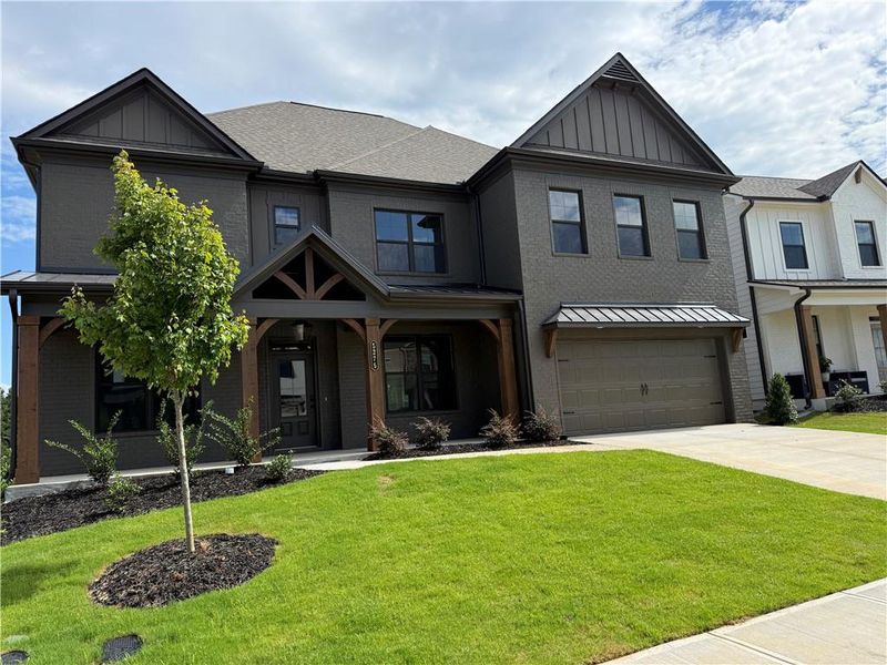 Front exterior of a new home in Ponderosa Farms Reserve, Gainesville, GA, highlighting curb appeal (Image 31). Front exterior of a new home in Ponderosa Farms Reserve, Gainesville, GA, highlighting curb appeal (Image 31).