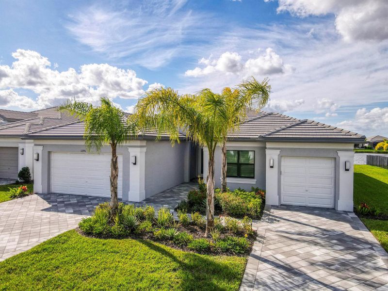Front exterior of a new home in , Port St. Lucie, FL, highlighting curb appeal (Image 20).