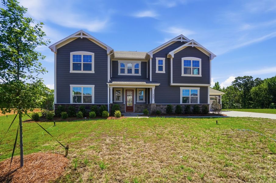 Front exterior of a new home in Blair Place, Monroe, NC, highlighting curb appeal (Image 1). Front exterior of a new home in Blair Place, Monroe, NC, highlighting curb appeal (Image 1).