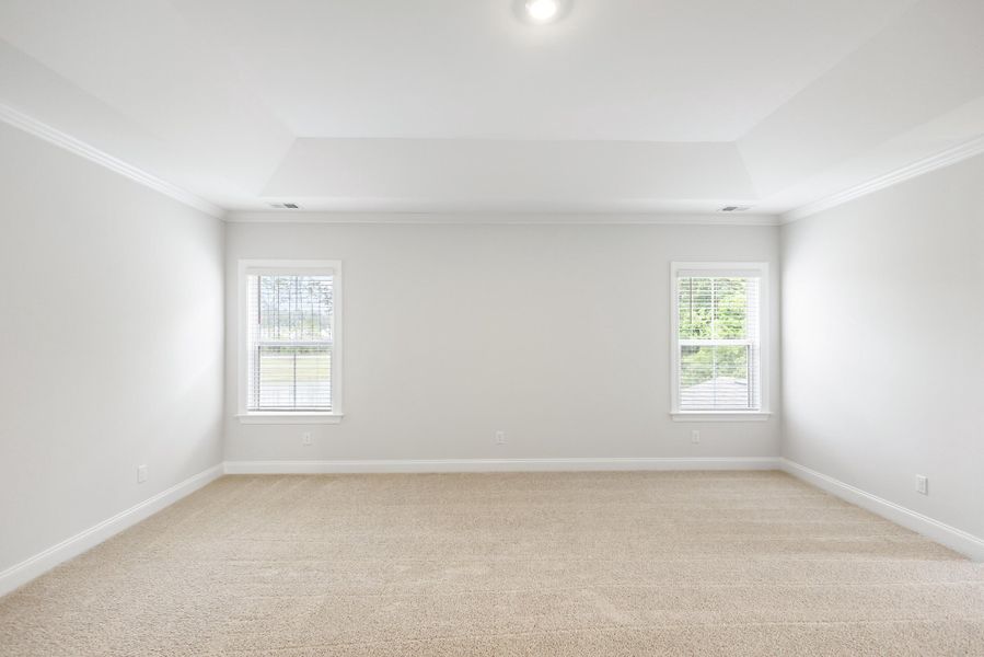Spacious, unfurnished interior of a new home in Tidewater at Lakes of Cane Bay, Summerville (Image 52).