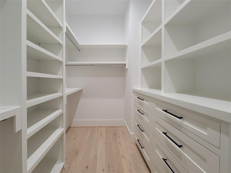 One of 2 walk-in closets in the primary bedroom.