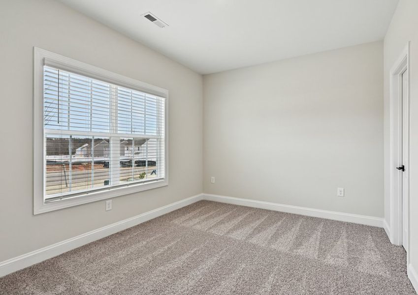 This secondary bedroom has a large picture window, letting in plenty of natural light This secondary bedroom has a large picture window, letting in plenty of natural light
