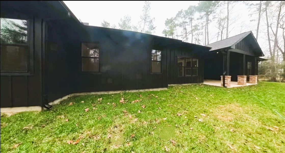 Exterior details and patio area of a home in , Conroe (Image 27).