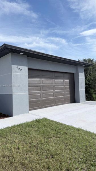 Front exterior of a new home in , Lehigh Acres, FL, highlighting curb appeal (Image 1). Front exterior of a new home in , Lehigh Acres, FL, highlighting curb appeal (Image 1).