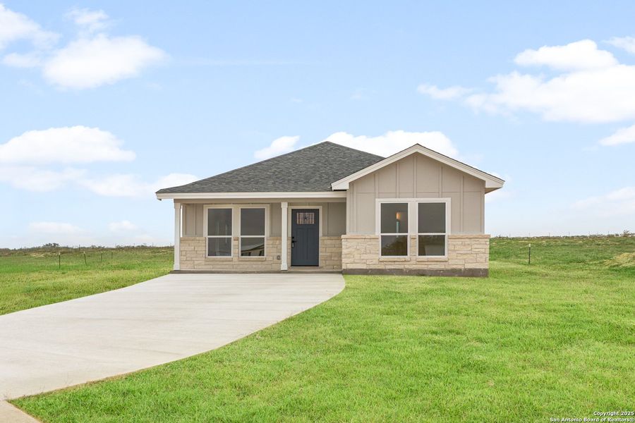 Front exterior of a new home in , La Vernia, TX, highlighting curb appeal (Image 15).