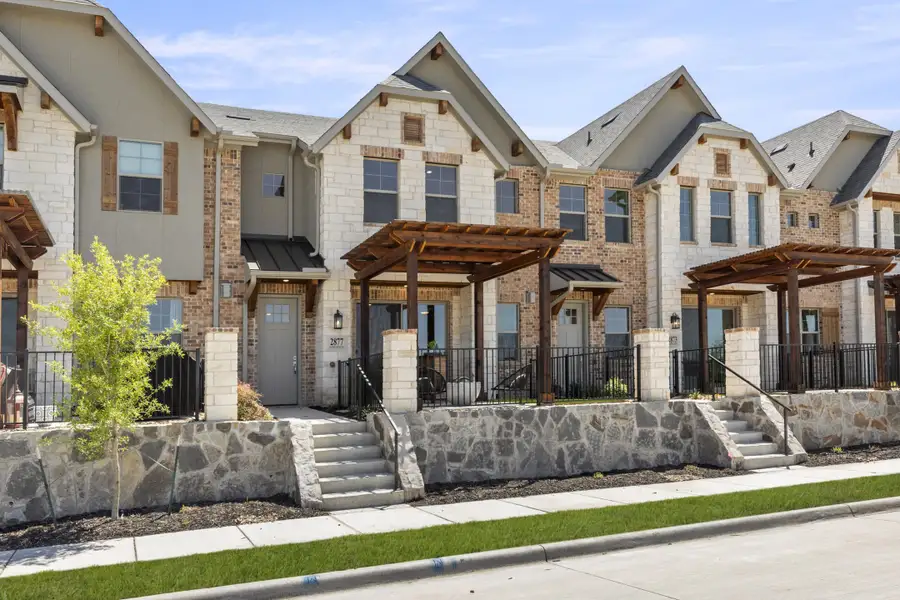 Front exterior of a new home in The Tribute, The Colony, TX, highlighting curb appeal (Image 1). Front exterior of a new home in The Tribute, The Colony, TX, highlighting curb appeal (Image 1).
