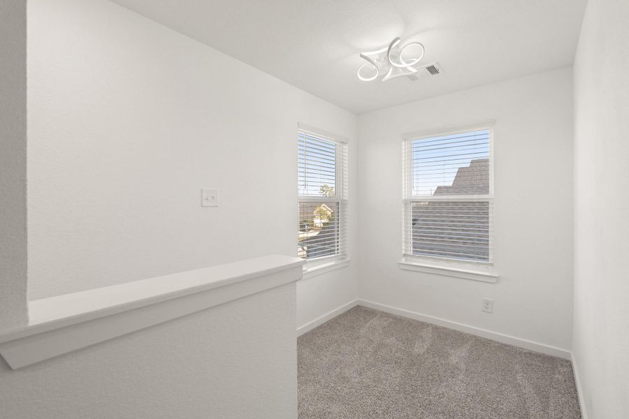 Upstairs, you are first greeted by a spacious landing that is perfect for a study space or reading nook!