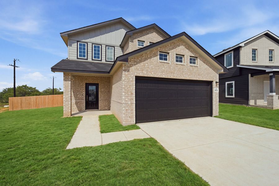 Front exterior of a new home in Garden Grove, San Antonio, TX, highlighting curb appeal (Image 2).
