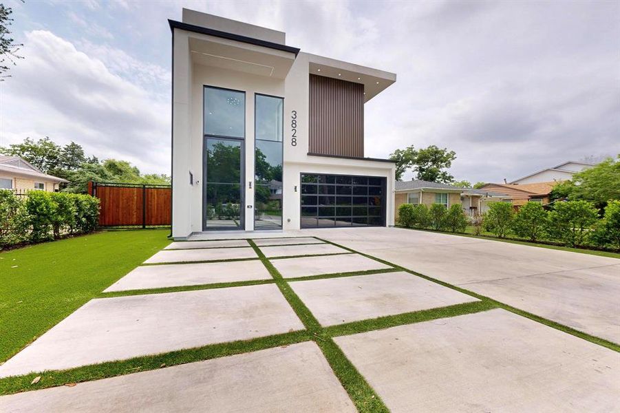 Modern home featuring driveway Modern home featuring driveway