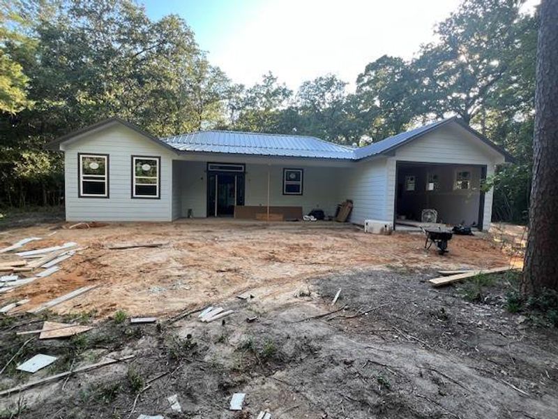 Front exterior of a new home in , Holly Lake Ranch, TX, highlighting curb appeal (Image 1). Front exterior of a new home in , Holly Lake Ranch, TX, highlighting curb appeal (Image 1).