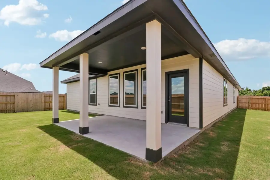 Exterior details and patio area of a home in Trinity Grove, Spring (Image 4).