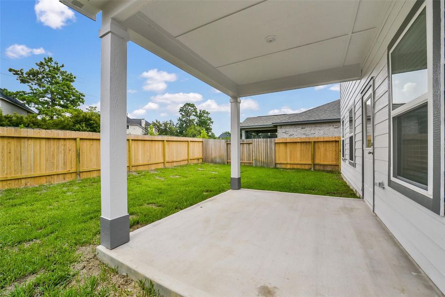 Exterior details and patio area of a home in Lakes at Black Oak, Magnolia (Image 19).