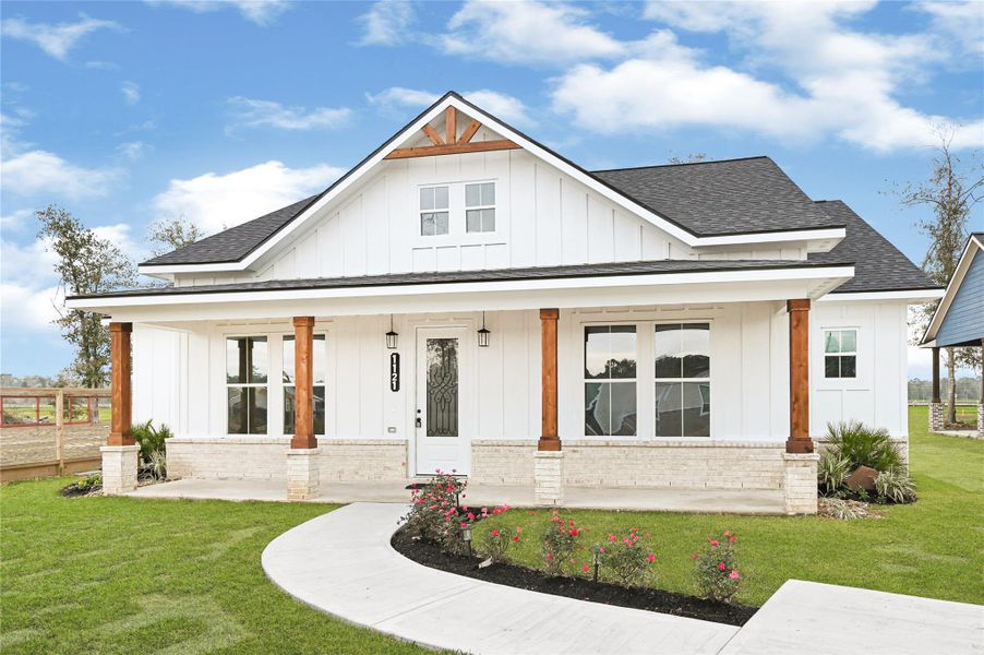 Front exterior of a new home in , Huffman, TX, highlighting curb appeal (Image 22). Front exterior of a new home in , Huffman, TX, highlighting curb appeal (Image 22).