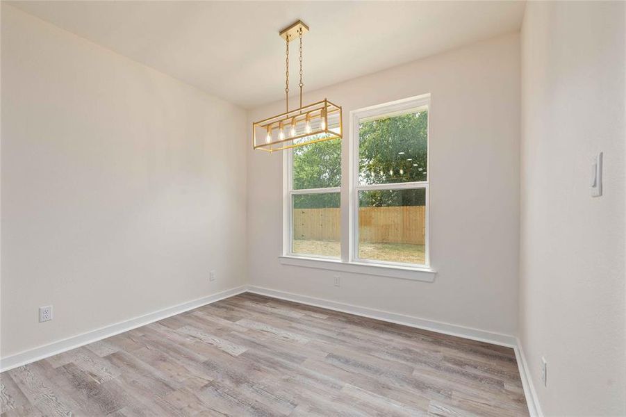 Unfurnished dining area with light wood-style flooring Unfurnished dining area with light wood-style flooring