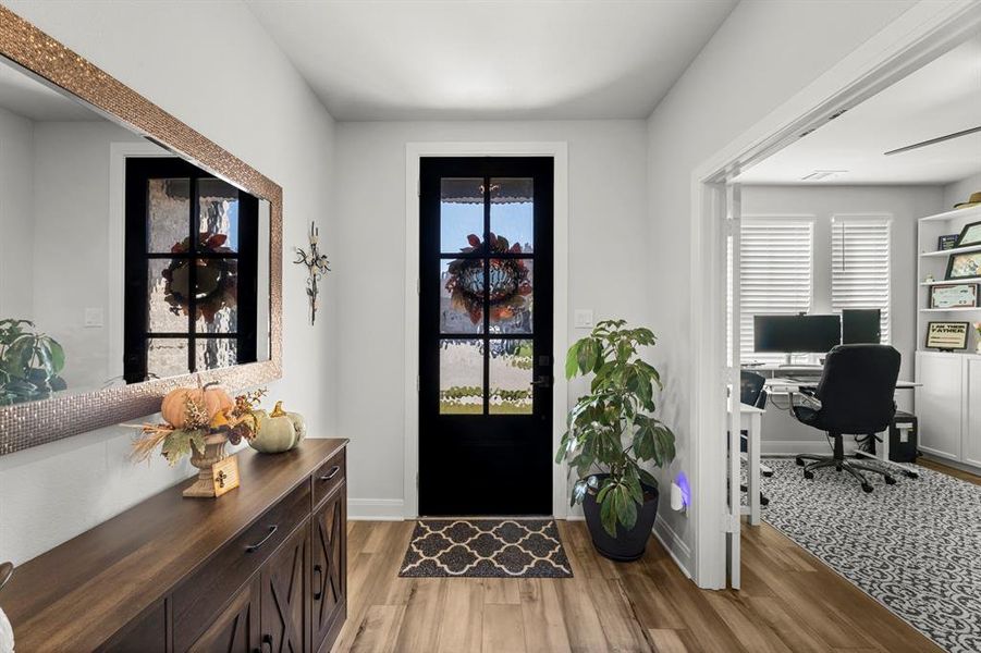 Entrance foyer with light wood-style floors and healthy amount of natural light Entrance foyer with light wood-style floors and healthy amount of natural light