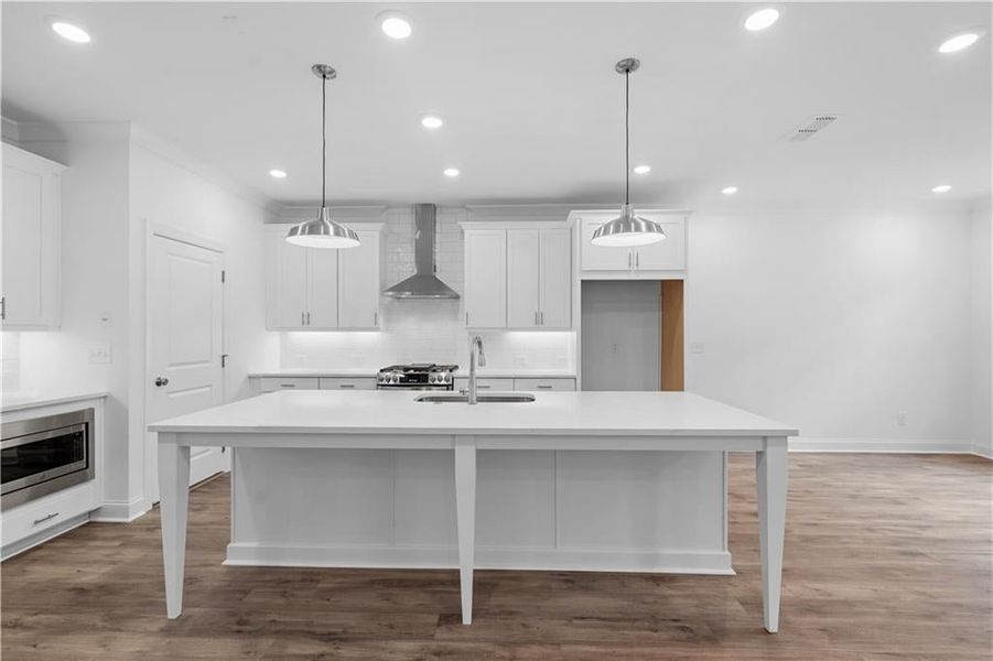 Lots of room for bar stools or chairs at the island - Pictures represent a previously built home