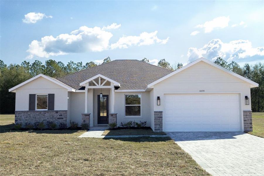 Front exterior of a new home in , Webster, FL, highlighting curb appeal (Image 2). Front exterior of a new home in , Webster, FL, highlighting curb appeal (Image 2).