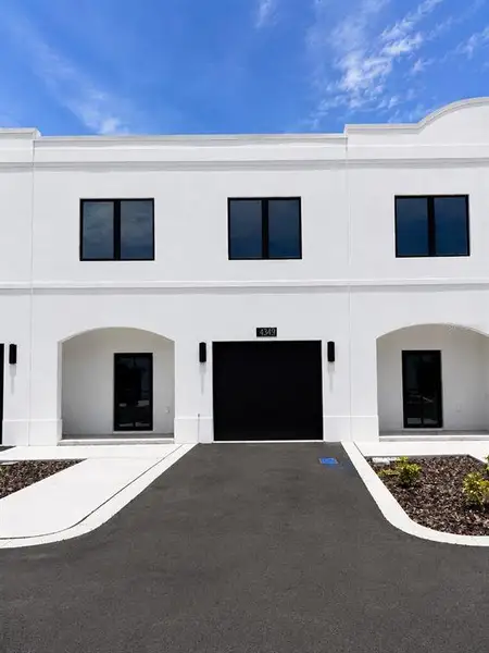 Front exterior of a new home in , Tampa, FL, highlighting curb appeal (Image 1). Front exterior of a new home in , Tampa, FL, highlighting curb appeal (Image 1).