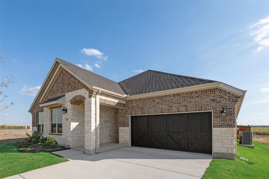 Front exterior of a new home in Arbors at Legacy Hills, Celina, TX, highlighting curb appeal (Image 17).