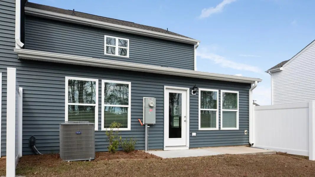 Exterior details and patio area of a home in Waterside Townhomes, Surf City (Image 3).
