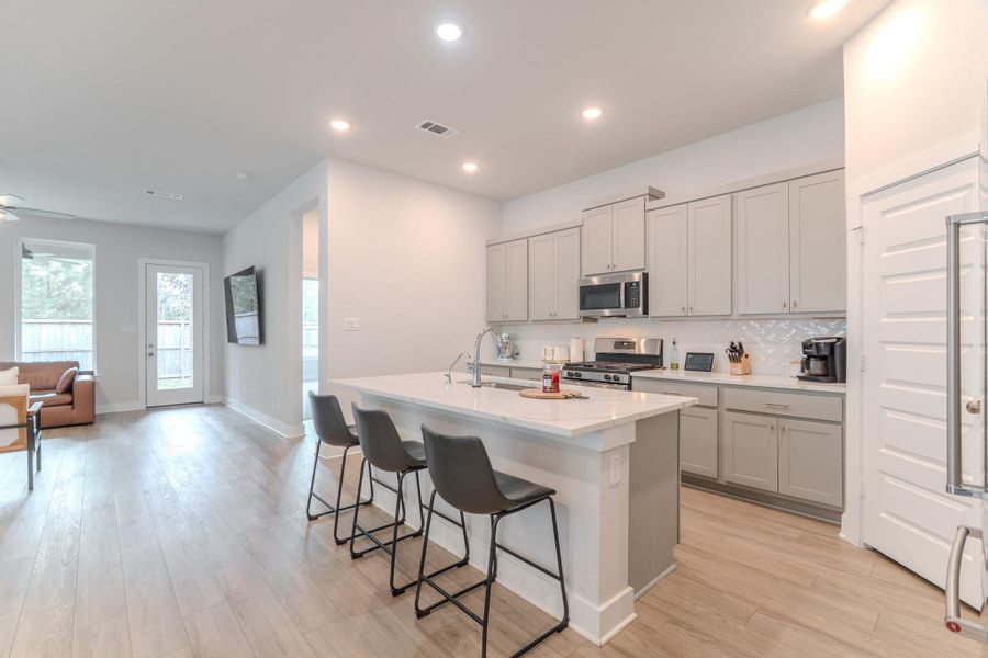 Furnished interior view inside a new home in Grand Central Park, Conroe (Image 5).