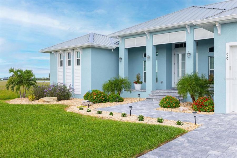 Front exterior of a new home in , Placida, FL, highlighting curb appeal (Image 22).