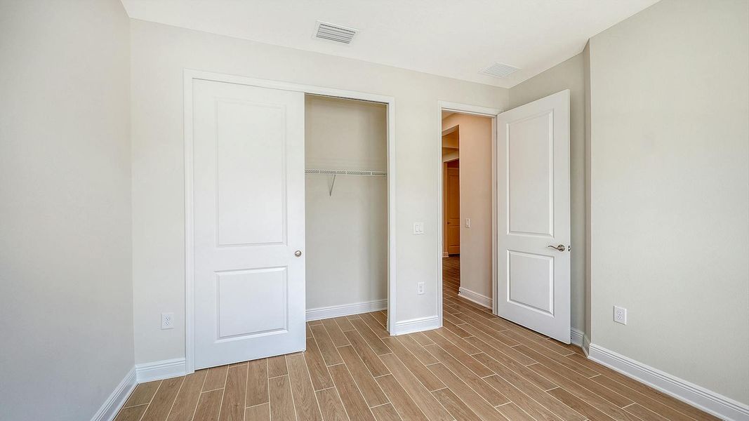 Spacious, unfurnished interior of a new home in Grand Park Real Estate and Homes for Sale in Sarasota, FL - Neal Communities, Sarasota (Image 45).