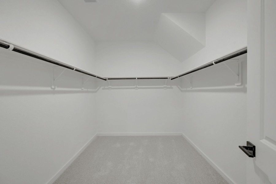 Primary walk-in closet Primary walk-in closet