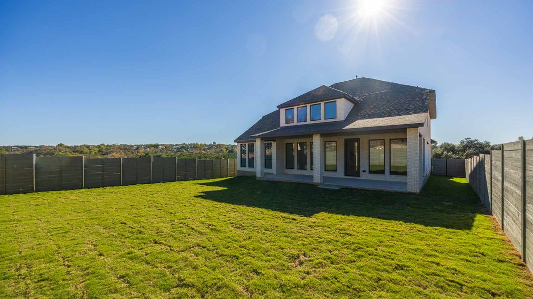 Exterior details and patio area of a home in Wolf Ranch 56', Georgetown (Image 2).
