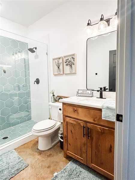 Bathroom with vanity and a stall shower Bathroom with vanity and a stall shower