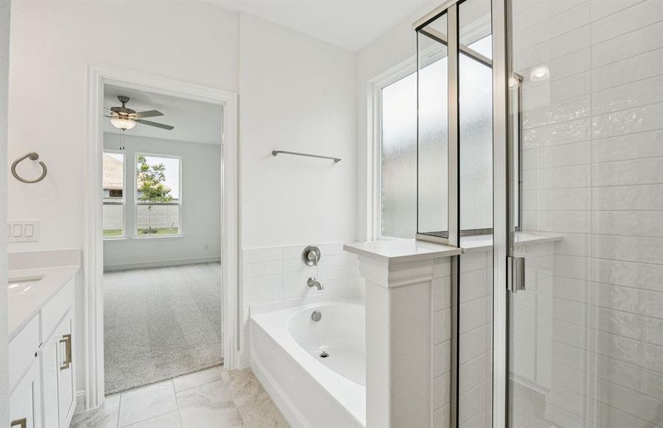 Modern owner's bath with dual vanities and a spacious shower *Real home pictured Modern owner's bath with dual vanities and a spacious shower *Real home pictured