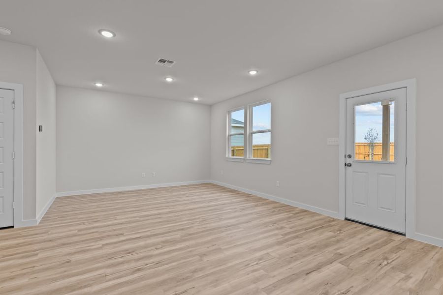 A room with a wood floor and white walls. A room with a wood floor and white walls.