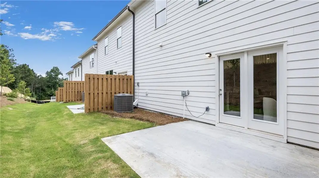 Exterior details and patio area of a home in Harvest Park, Decatur (Image 4).