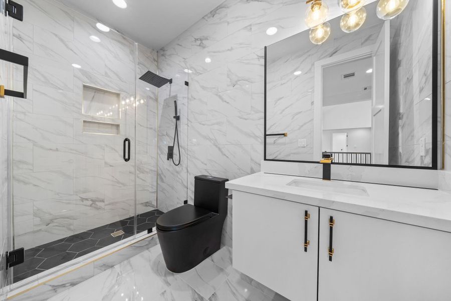 This secondary bathroom has a glass enclosed shower, and many updates. This secondary bathroom has a glass enclosed shower, and many updates.