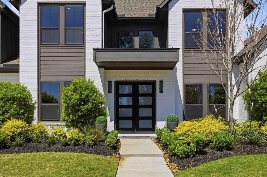 Front exterior of a new home in Artavia, Conroe, TX, highlighting curb appeal (Image 22).