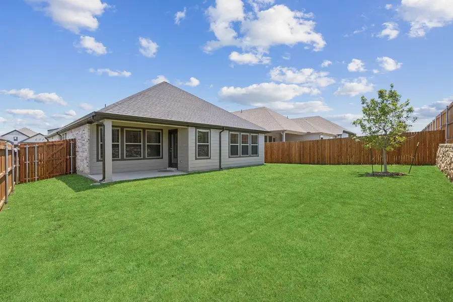 Exterior details and patio area of a home in Prairie Winds, Hutto (Image 17).