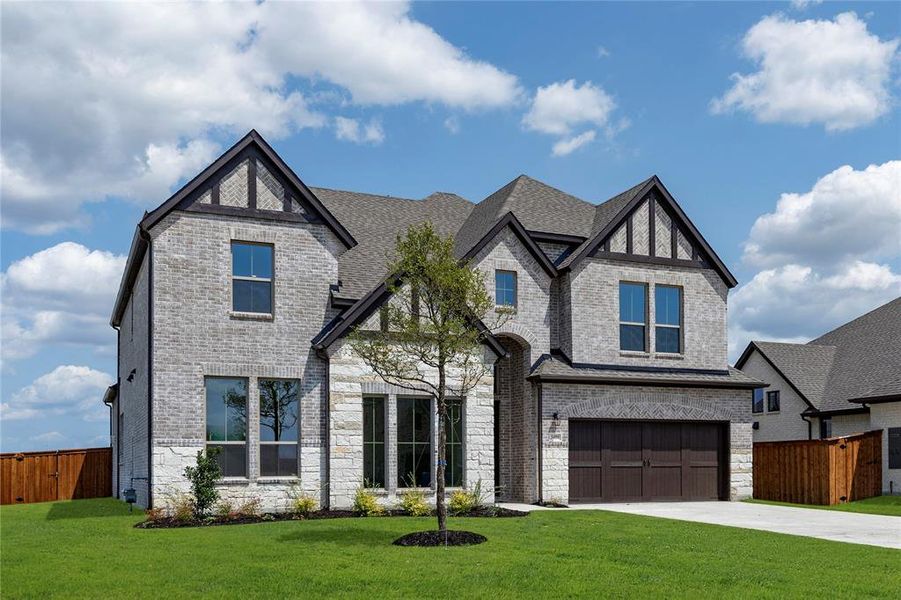 Front exterior of a new home in Nelson Lake, Rockwall, TX, highlighting curb appeal (Image 2). Front exterior of a new home in Nelson Lake, Rockwall, TX, highlighting curb appeal (Image 2).